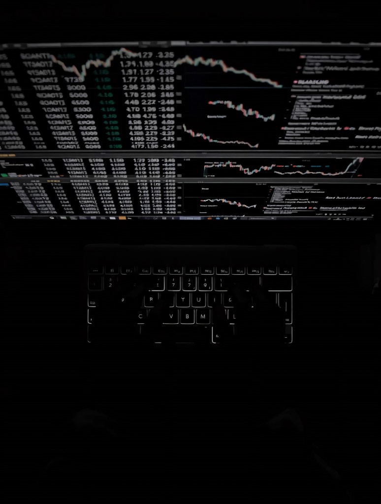 Financial analysis on a laptop with market data